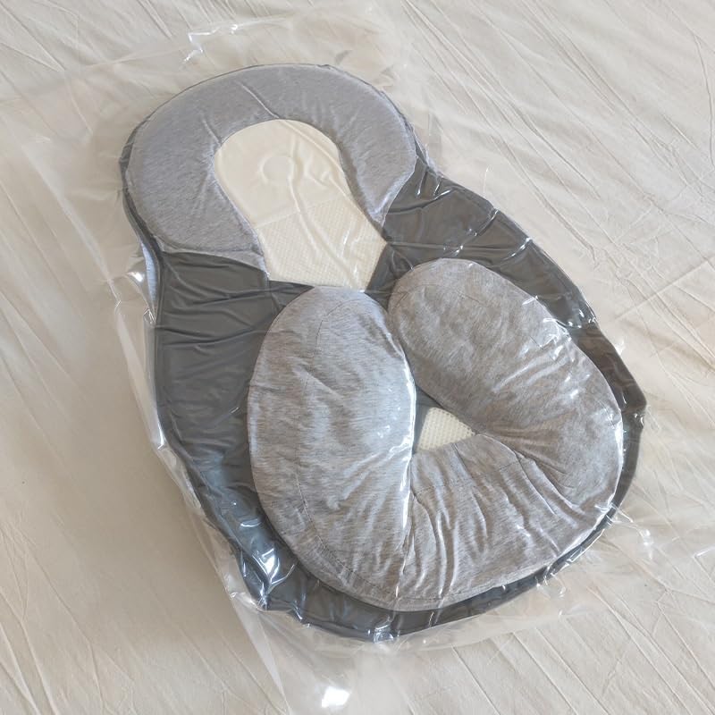 Babywig voor het ledikant